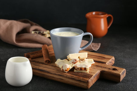 Cup with hot white chocolate on dark backgroundの写真素材