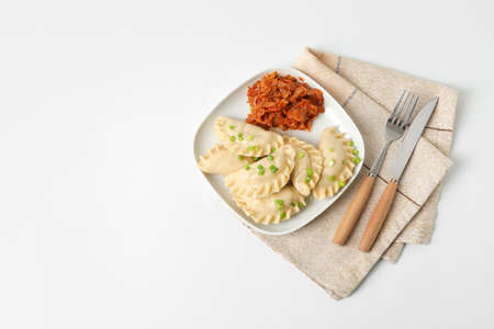 Plate with tasty dumplings on light backgroundの写真素材