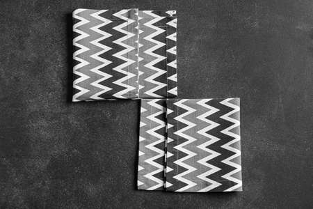 Stylish napkins on dark background