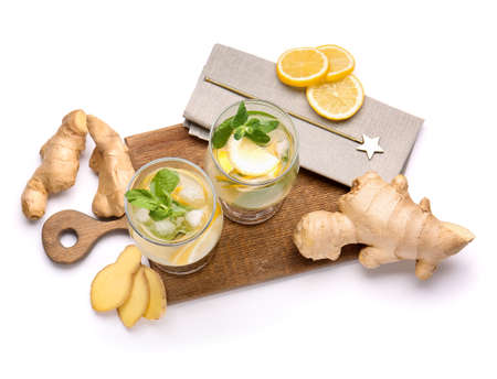 Glasses of cold ginger lemonade on white backgroundの写真素材