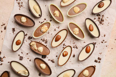 Tasty chocolate candies on color backgroundの写真素材