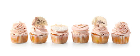 Tasty wedding cupcakes on white backgroundの写真素材