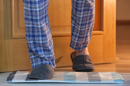 Man wearing soft slippers at home, closeupの写真素材