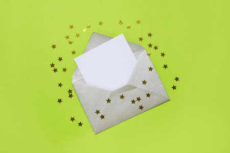 Envelope with blank card on color background