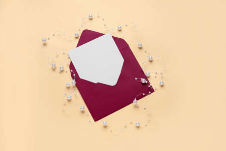 Envelope with blank card on color backgroundの写真素材