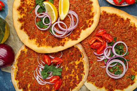 Delicious Turkish pizza on color background