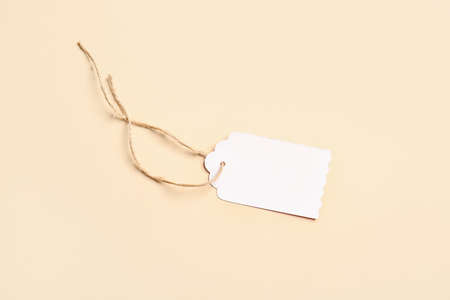 Stylish blank tag on color backgroundの写真素材