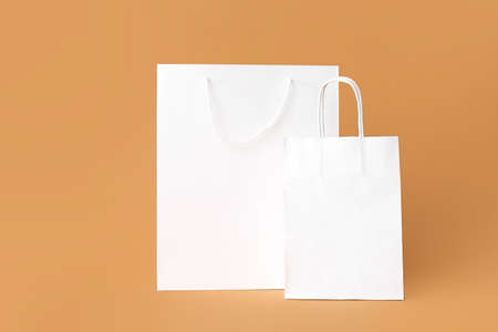 Blank paper bags on color backgroundの写真素材