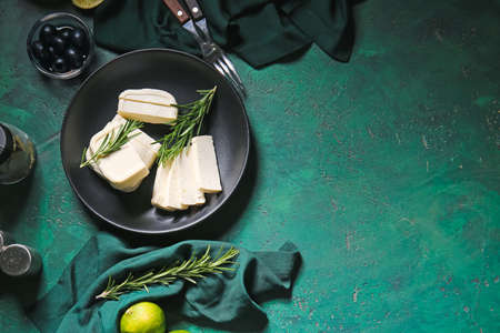 Plate with delicious feta cheese on color backgroundの写真素材
