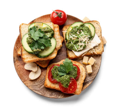 Tasty toasts with pesto sauce and garlic on white backgroundの写真素材