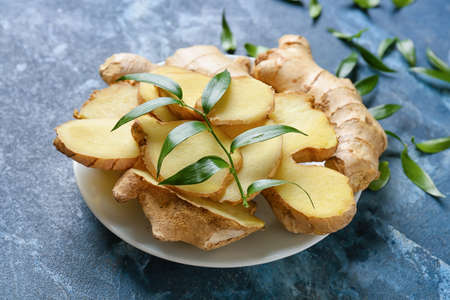 Composition with fresh ginger on color background