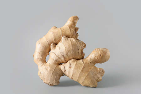 fresh ginger on gray background