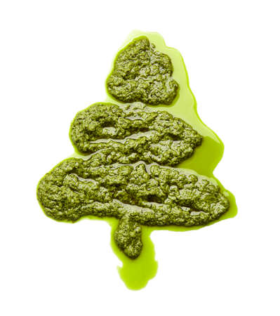 Christmas tree made of tasty pesto sauce on white backgroundの写真素材