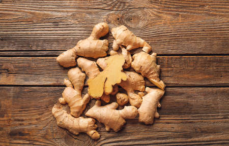fresh ginger on wooden backgroundの写真素材