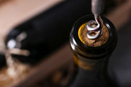 Bottles of exquisite wine with corkscrew, closeupの写真素材
