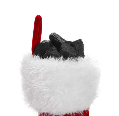Christmas sock with coal on white background