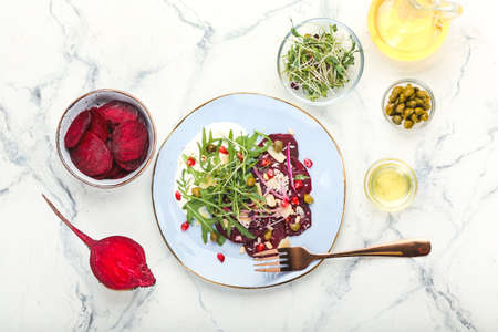 Composition with delicious beetroot carpaccio on light backgroundの写真素材