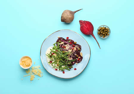 Composition with delicious beetroot carpaccio on color backgroundの写真素材