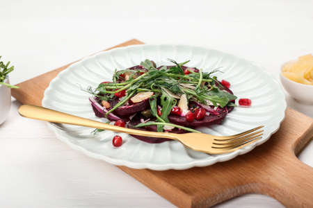 Plate with delicious beetroot carpaccio on white wooden tableの写真素材