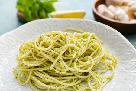 Plate with tasty pesto pasta on table, closeupの写真素材