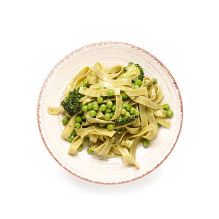 Plate with tasty pasta and vegetables on white backgroundの写真素材