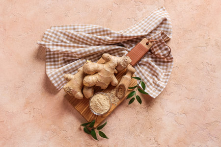 Ginger powder and roots on color background