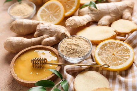 Composition with ginger, honey and lemon on color backgroundの写真素材