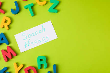 Paper with text SPEECH THERAPY and letters on color backgroundの写真素材
