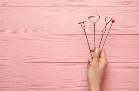 Woman with logopedic tools for speech correction on color wooden backgroundの写真素材