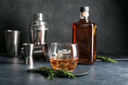 Glass of cold whiskey on dark backgroundの写真素材