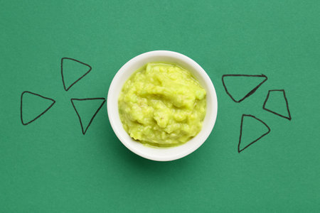 Creative composition with tasty guacamole on color backgroundの写真素材