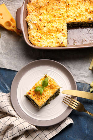 Plate with tasty green lasagna on color backgroundの写真素材