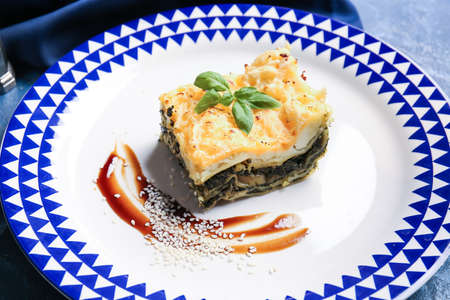 Plate with tasty green lasagna on table, closeupの写真素材