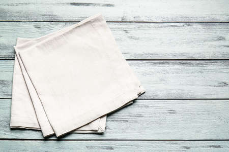 Fabric napkins on color wooden backgroundの写真素材