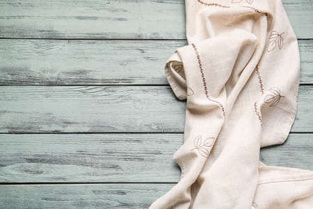 Fabric napkin on color wooden backgroundの写真素材