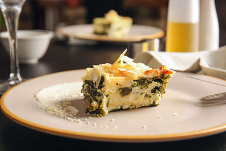 Plate with tasty green lasagna on table, closeupの写真素材