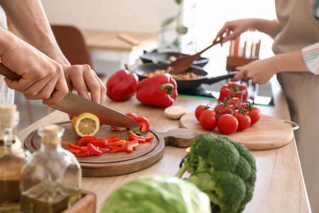 Young couple cooking in kitchen