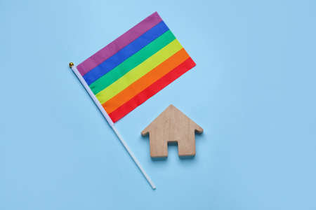 LGBT flag and figure of house on color backgroundの写真素材