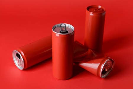 Cans of soda on color backgroundの写真素材