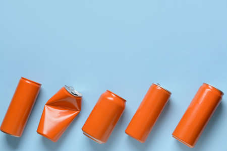 Cans of soda on color backgroundの写真素材