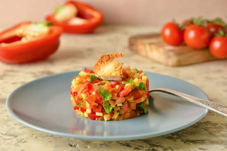 Plate with tasty tartare salad on color background, closeupの写真素材
