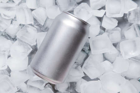 Can of soda on ice cubesの写真素材