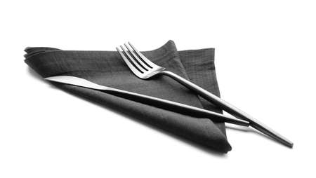 Fabric napkin and cutlery on white backgroundの写真素材