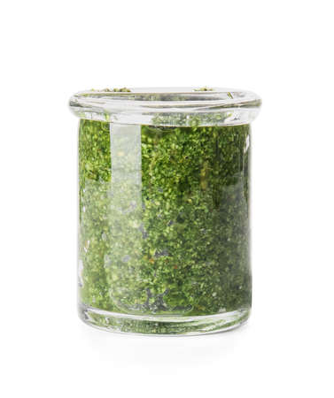 Jar with fresh pesto sauce on white backgroundの写真素材