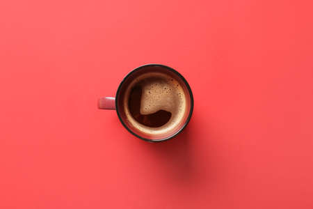 Cup of coffee on red backgroundの写真素材