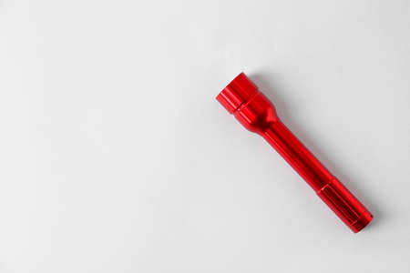 Modern flashlight on light backgroundの写真素材