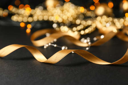 golden ribbon on dark backgroundの写真素材