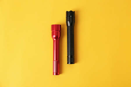 Modern flashlights on color backgroundの写真素材