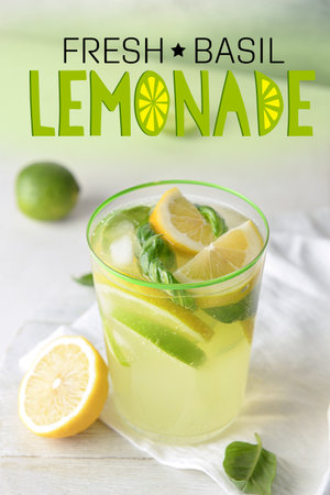 Glass of tasty basil lemonade on tableの写真素材