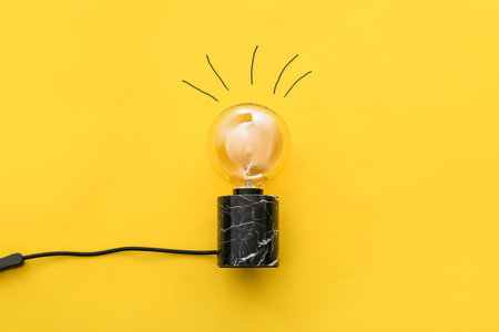 Stylish lamp on color backgroundの写真素材